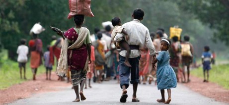 Christians return for shelter after spending days in hiding in forest at Naugram village